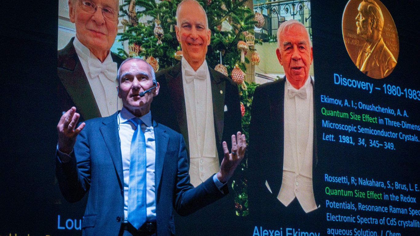 Speaker presents nobel laureates on screen