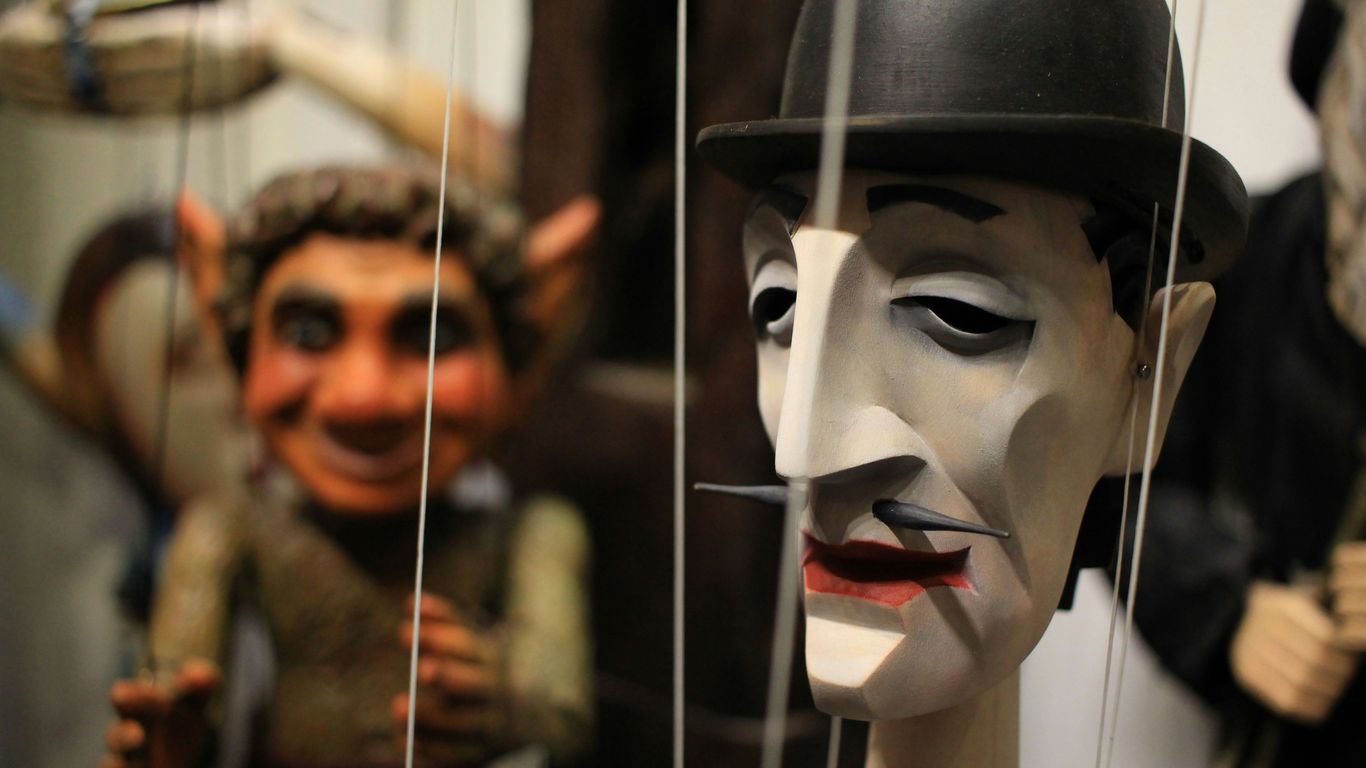 a group of masks that are on display