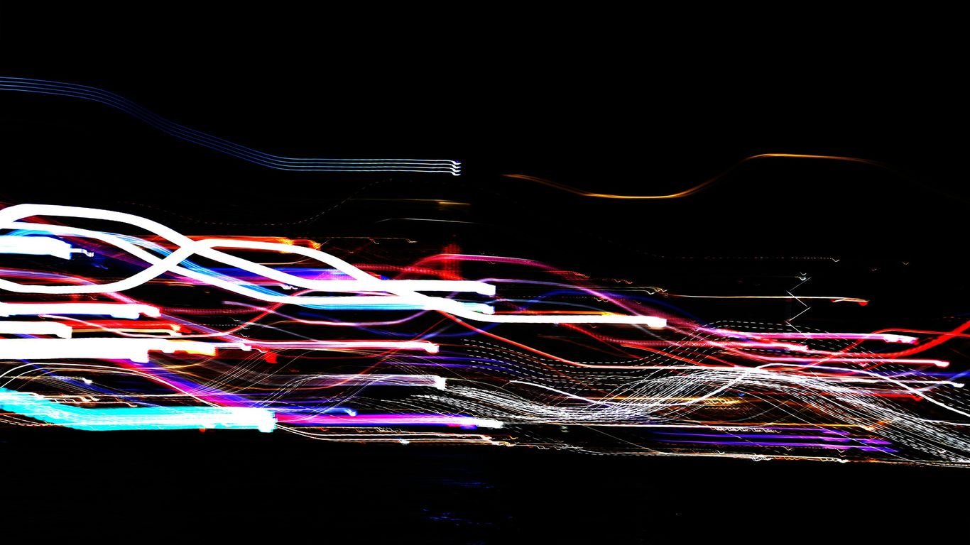 Abstract light trails on black background