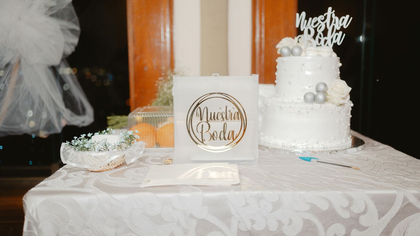 Wedding guest book displayed on a clear tray