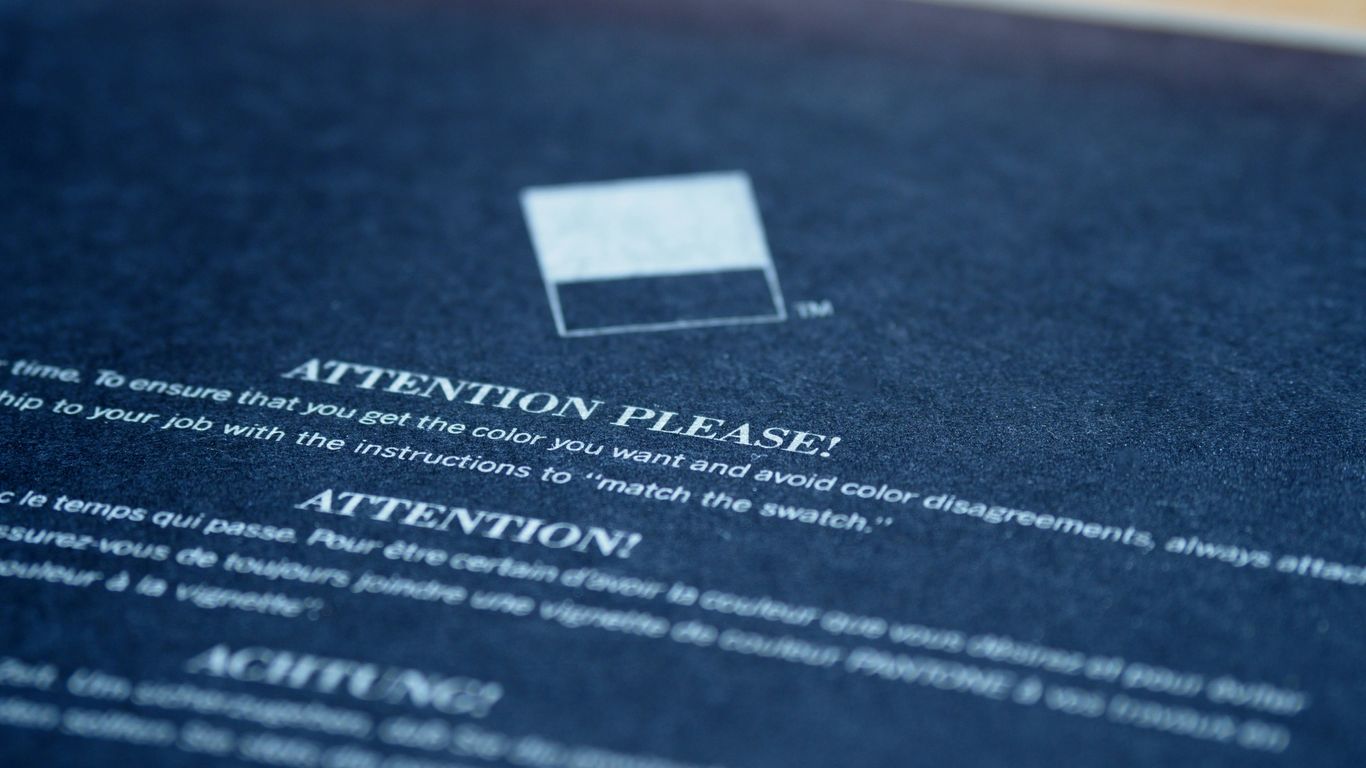 white card on blue textile