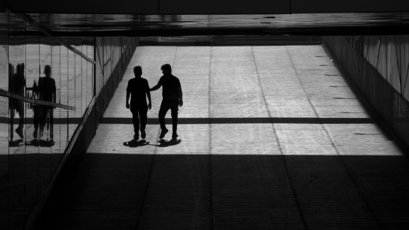 a couple of men standing next to each other