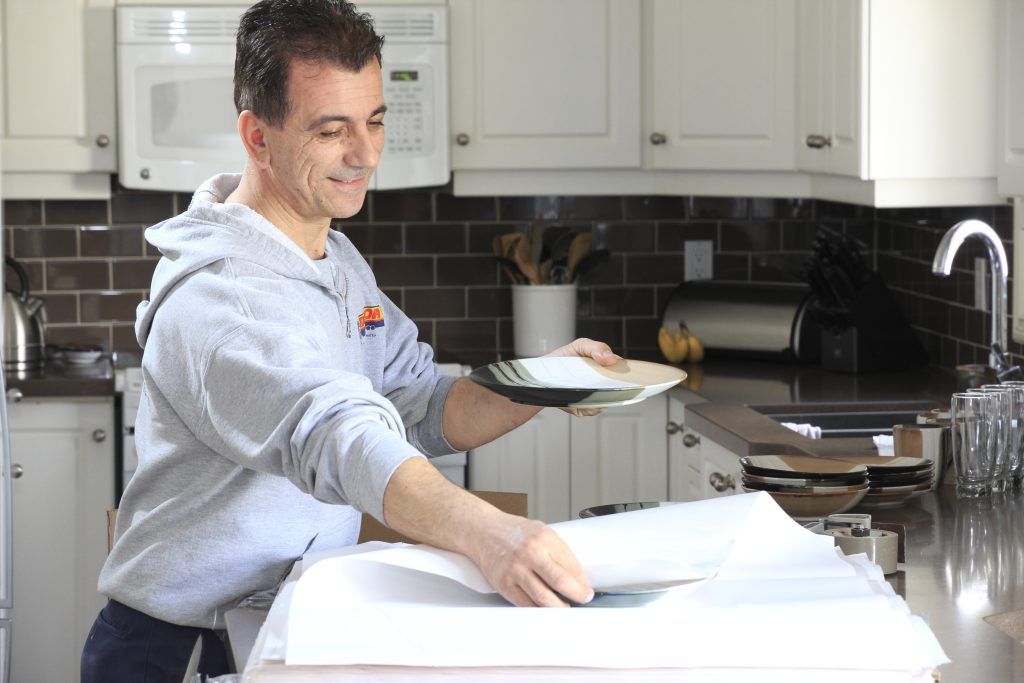 Professional packers preparing belongings