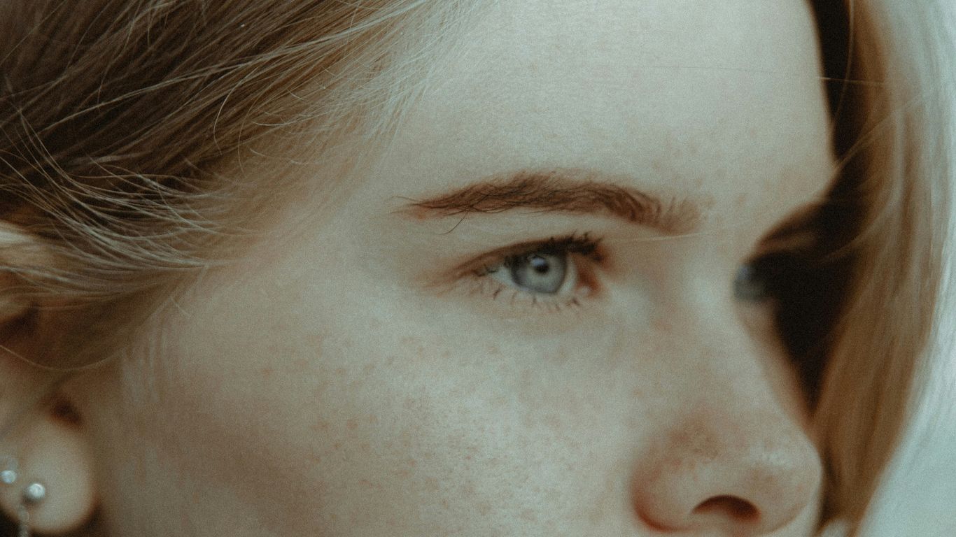 womans face with blue eyes