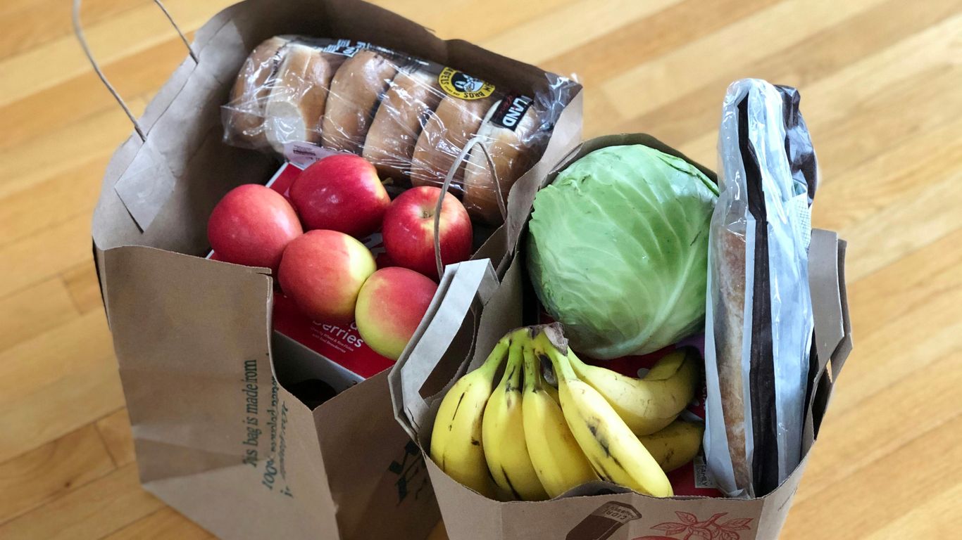 A robot delivering groceries to a home