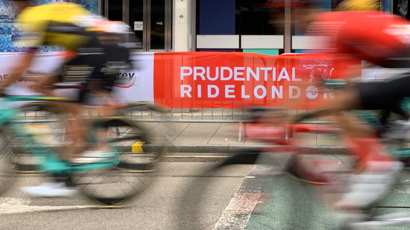 men riding bikes on road near building