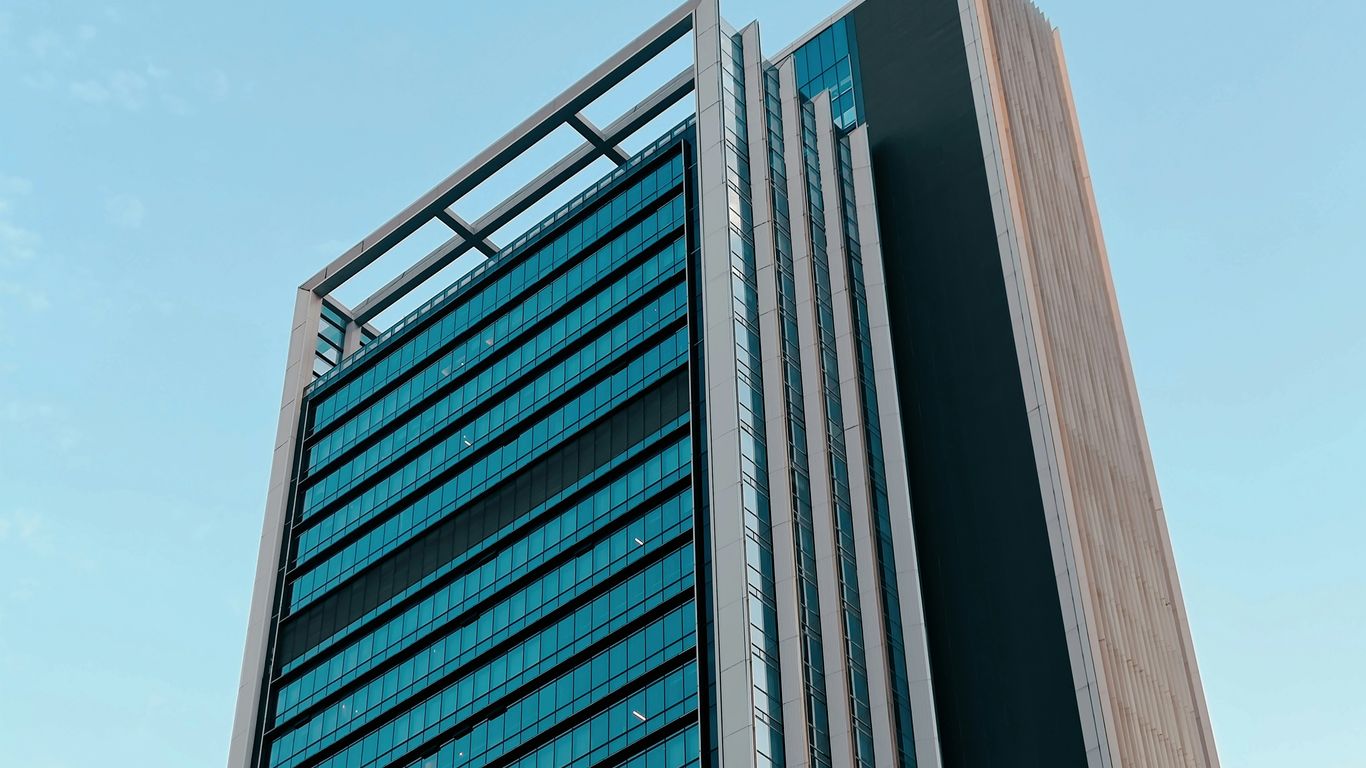 a tall building with a sky background
