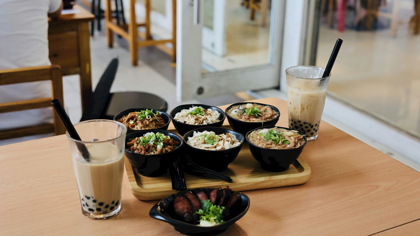 Morning kopi beside shared dining tables