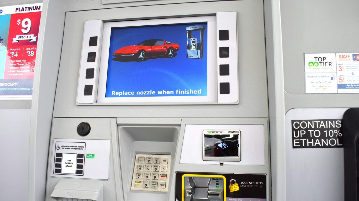 a gas pump with a picture of a red car on it