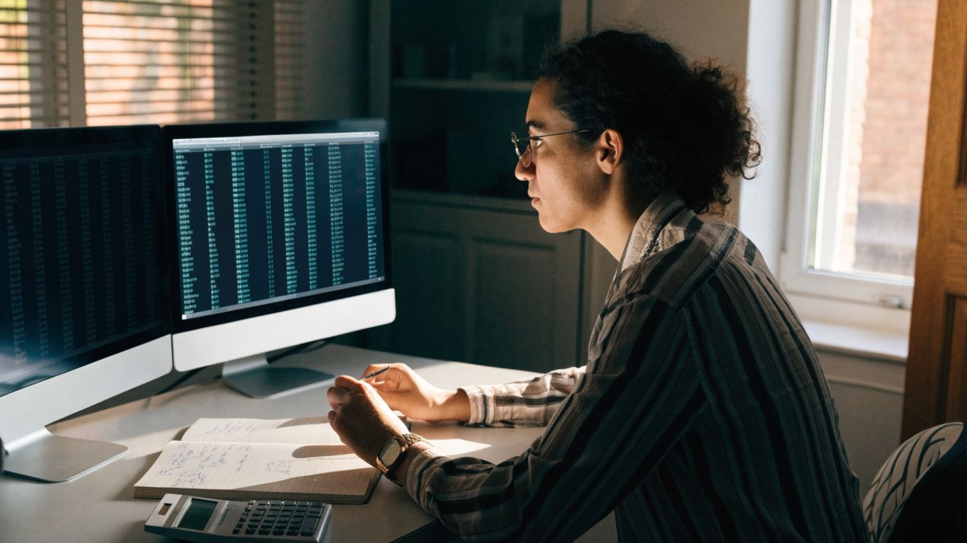 A trader reviewing futures account details at a desk