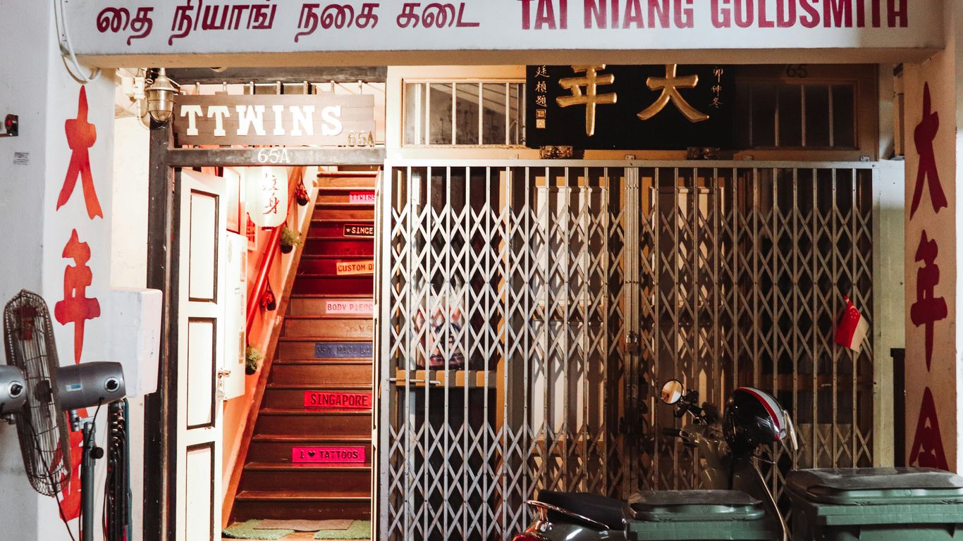 Colorful shophouses lining a narrow alleyway