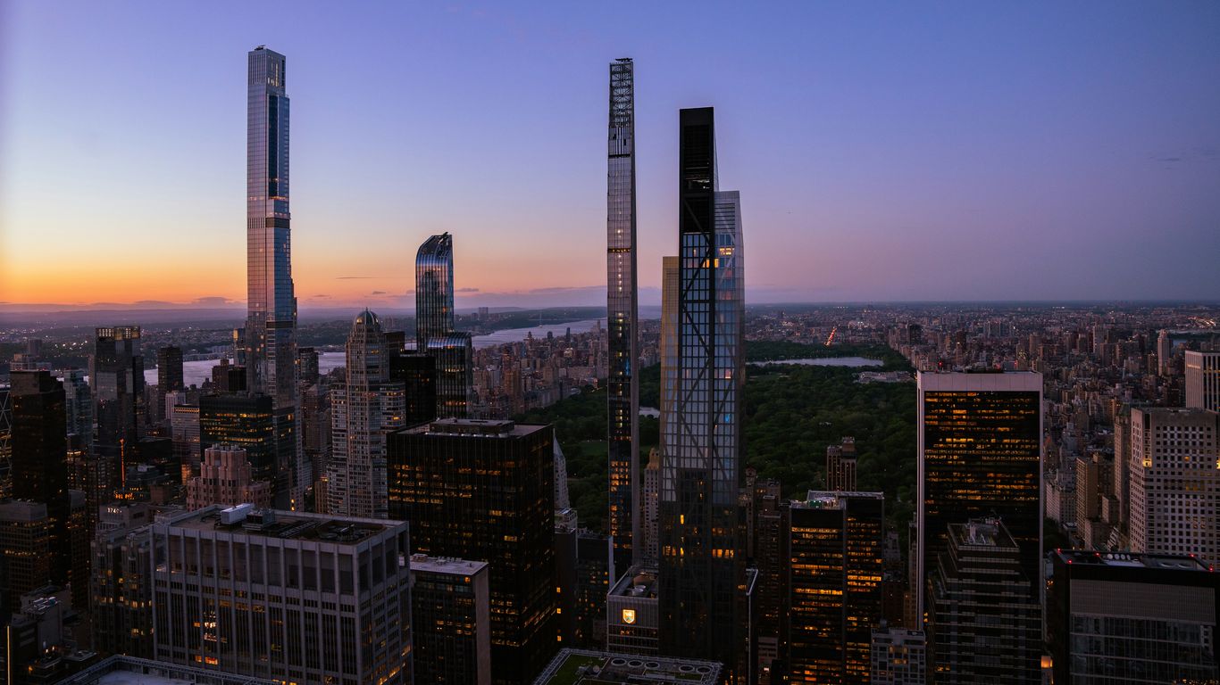 an aerial view of a city at dusk