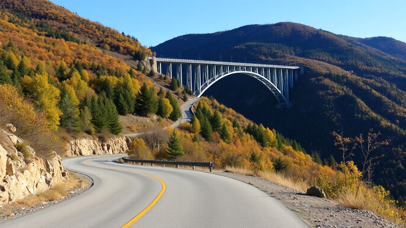 Winding mountain road with steel bridge