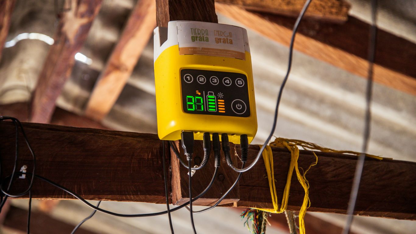Yellow device with digital display mounted on wooden beam