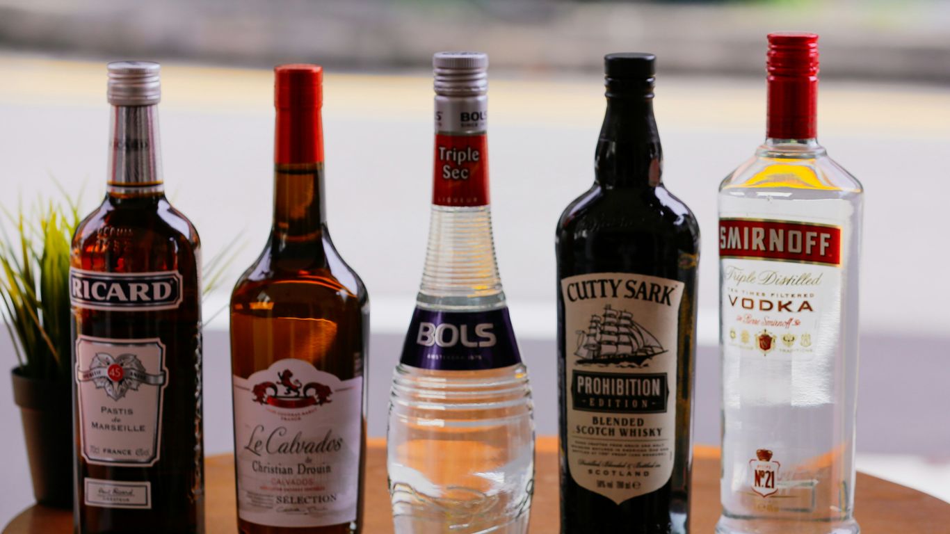 three bottles on white table