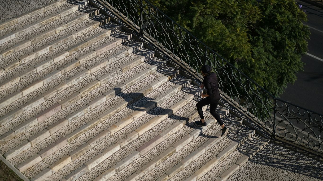 a man walking down a flight of stairs