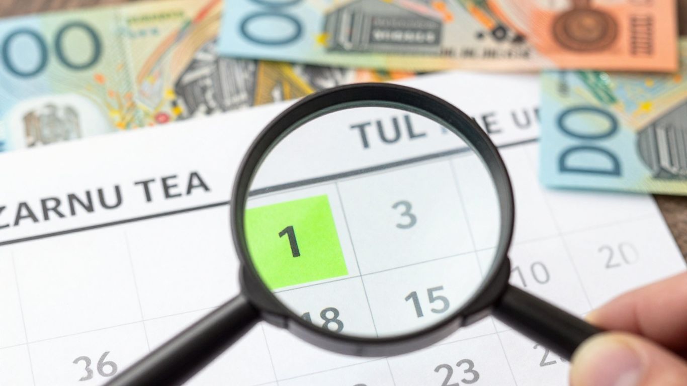 Economic calendar with magnifying glass over event.