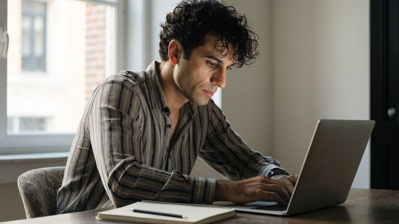 Trader reviewing futures account activity at a desk