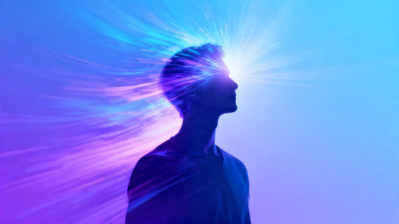 Person's silhouette with light of growth emanating from head.