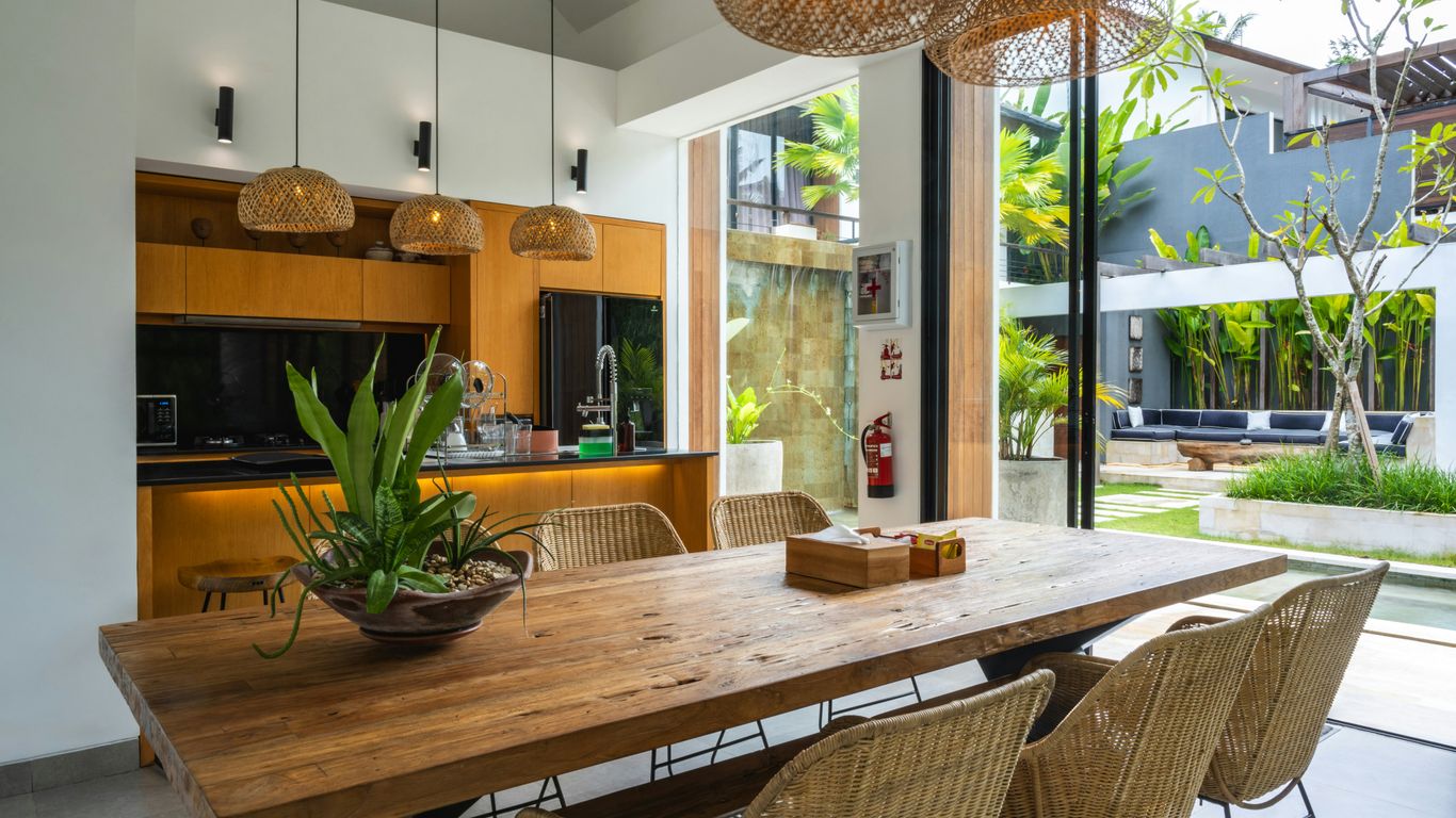 Dining table beside open kitchen