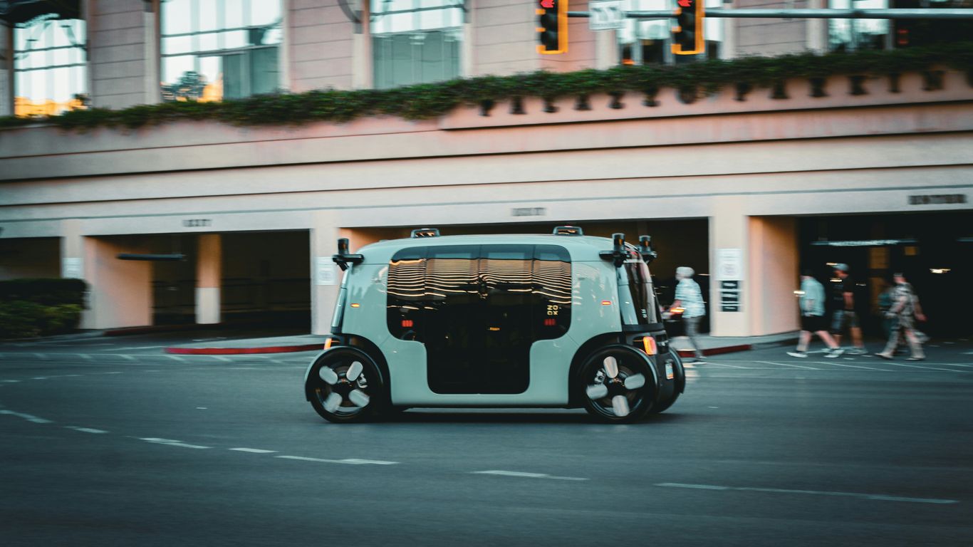 Autonomous vehicle driving on a city street.