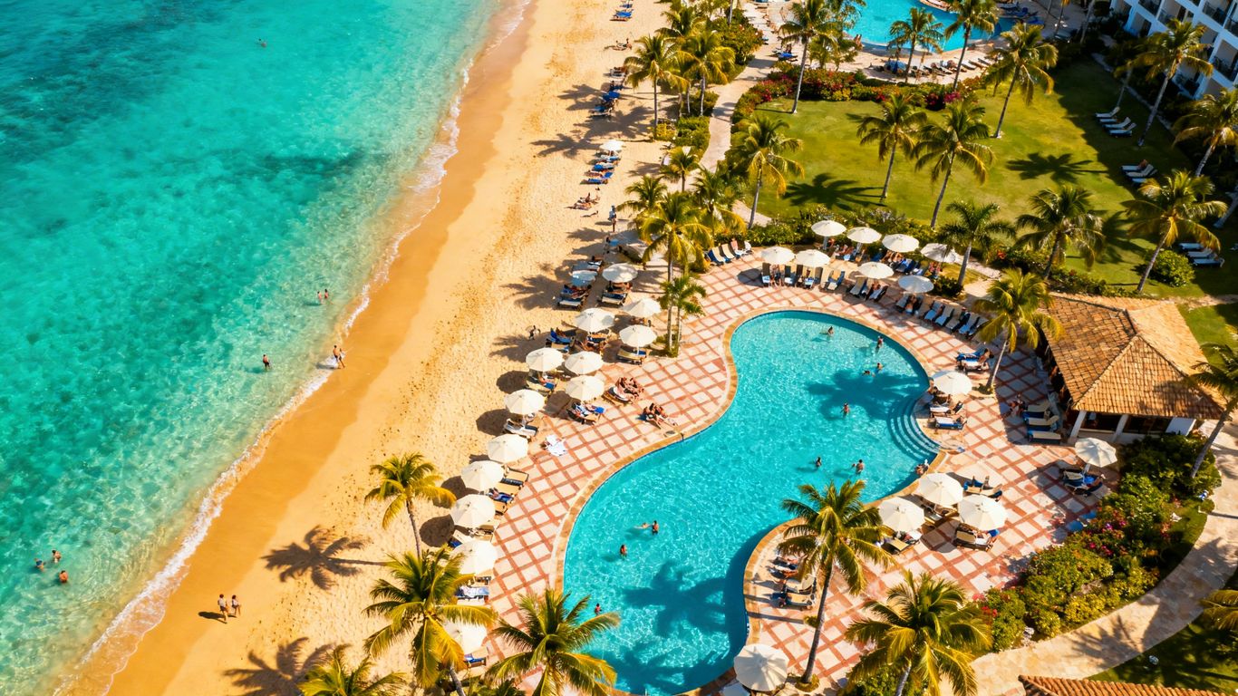 Luxury Cabo resort with swimmable beach and palm trees