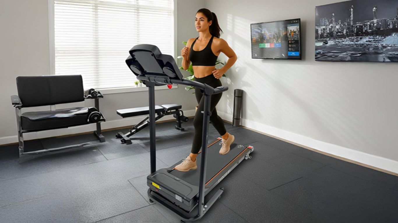 A person runs on a treadmill in a home gym.