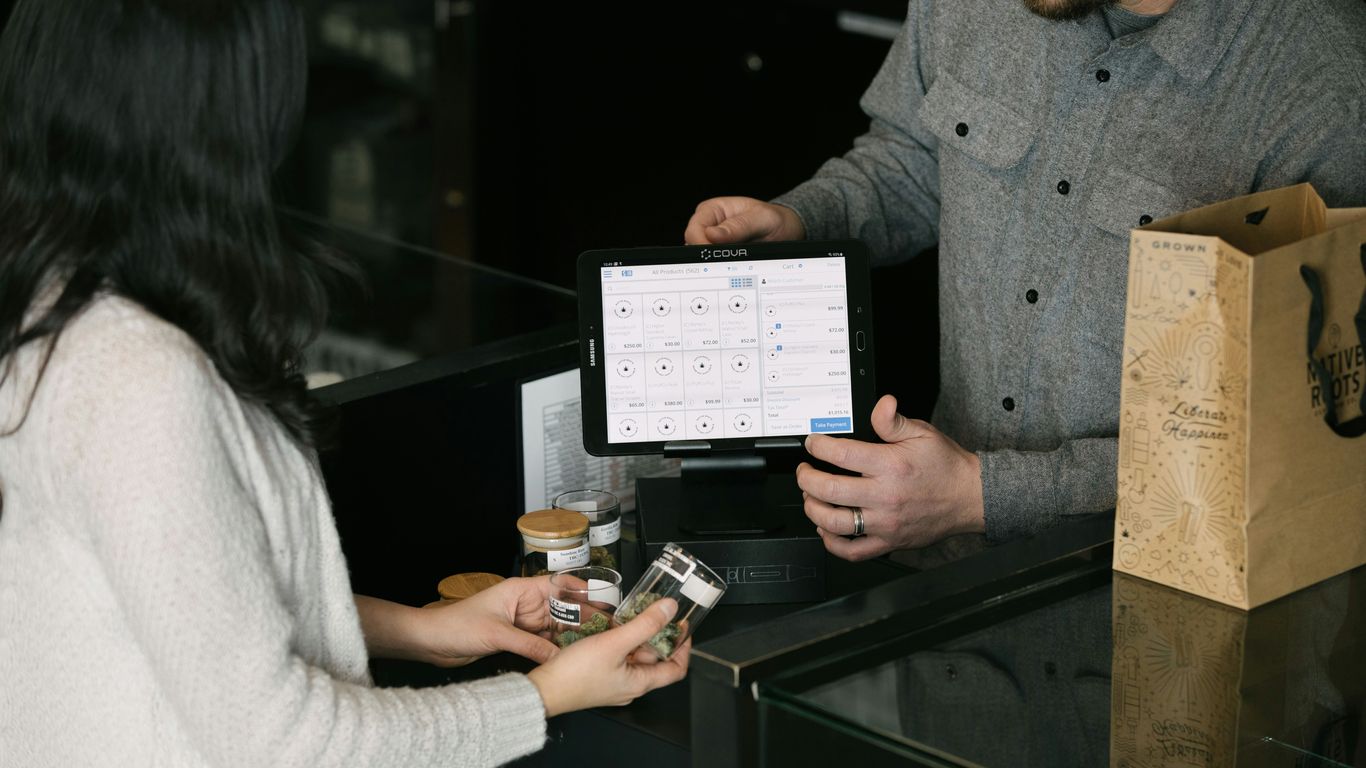 a man and a woman standing in front of a counter