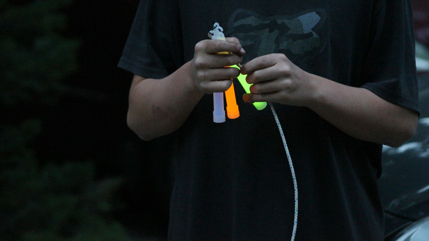 a man holding a pair of scissors in his hands