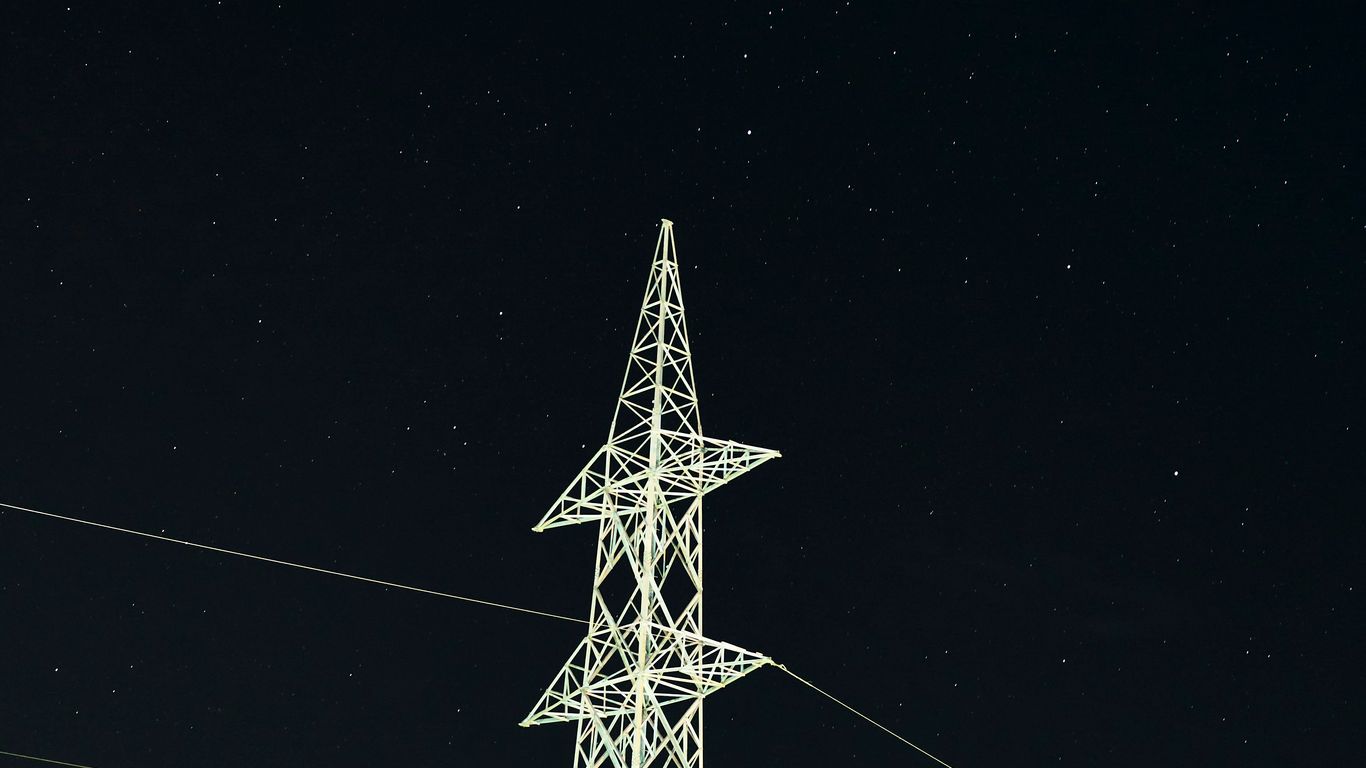 white and black electric tower during night time