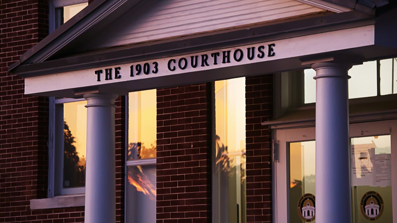 The 1903 courthouse is shown at sunset.