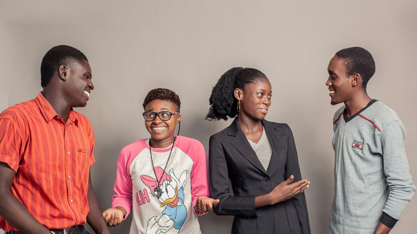 3 men and 2 women standing side by side