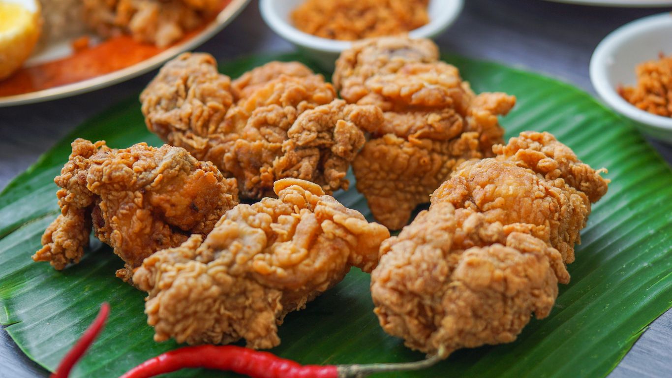 Crispy golden spring chicken served with spicy chili