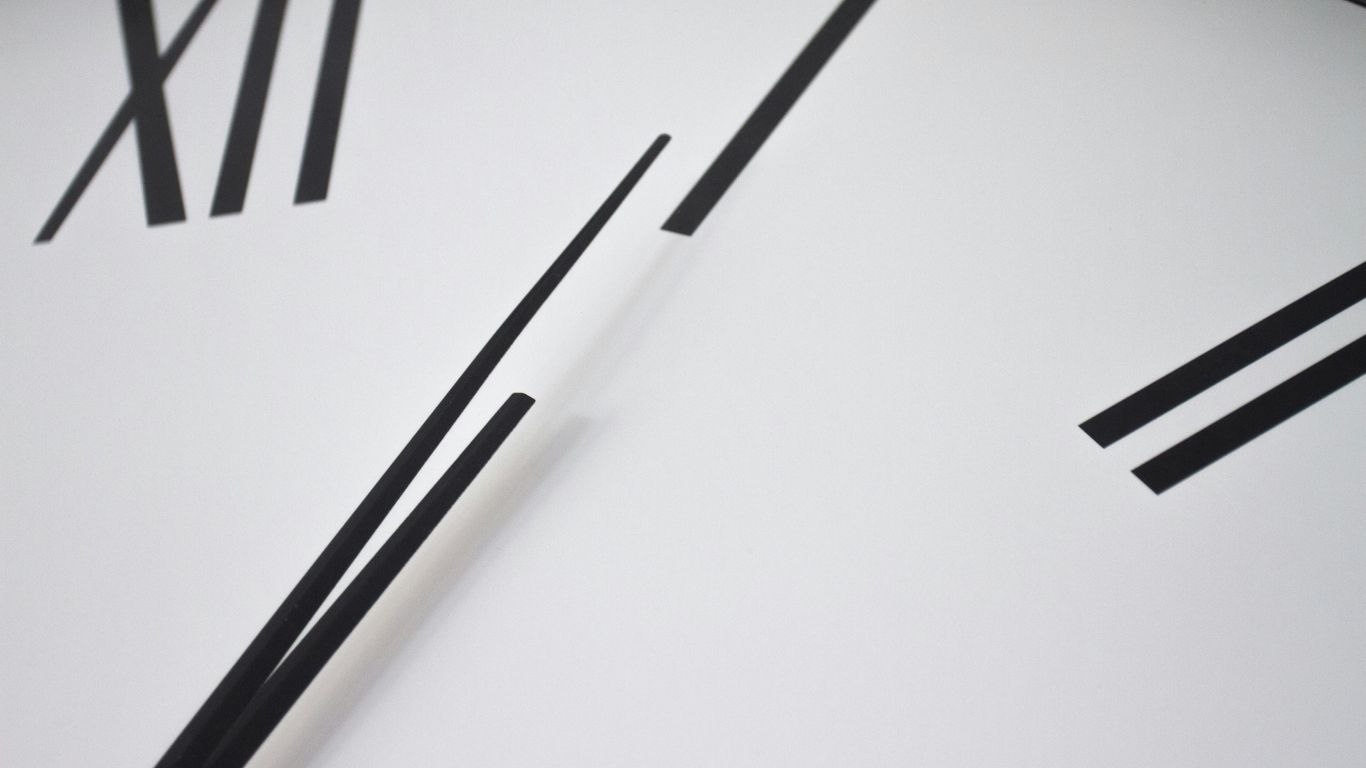 Clock beside international shipping paperwork