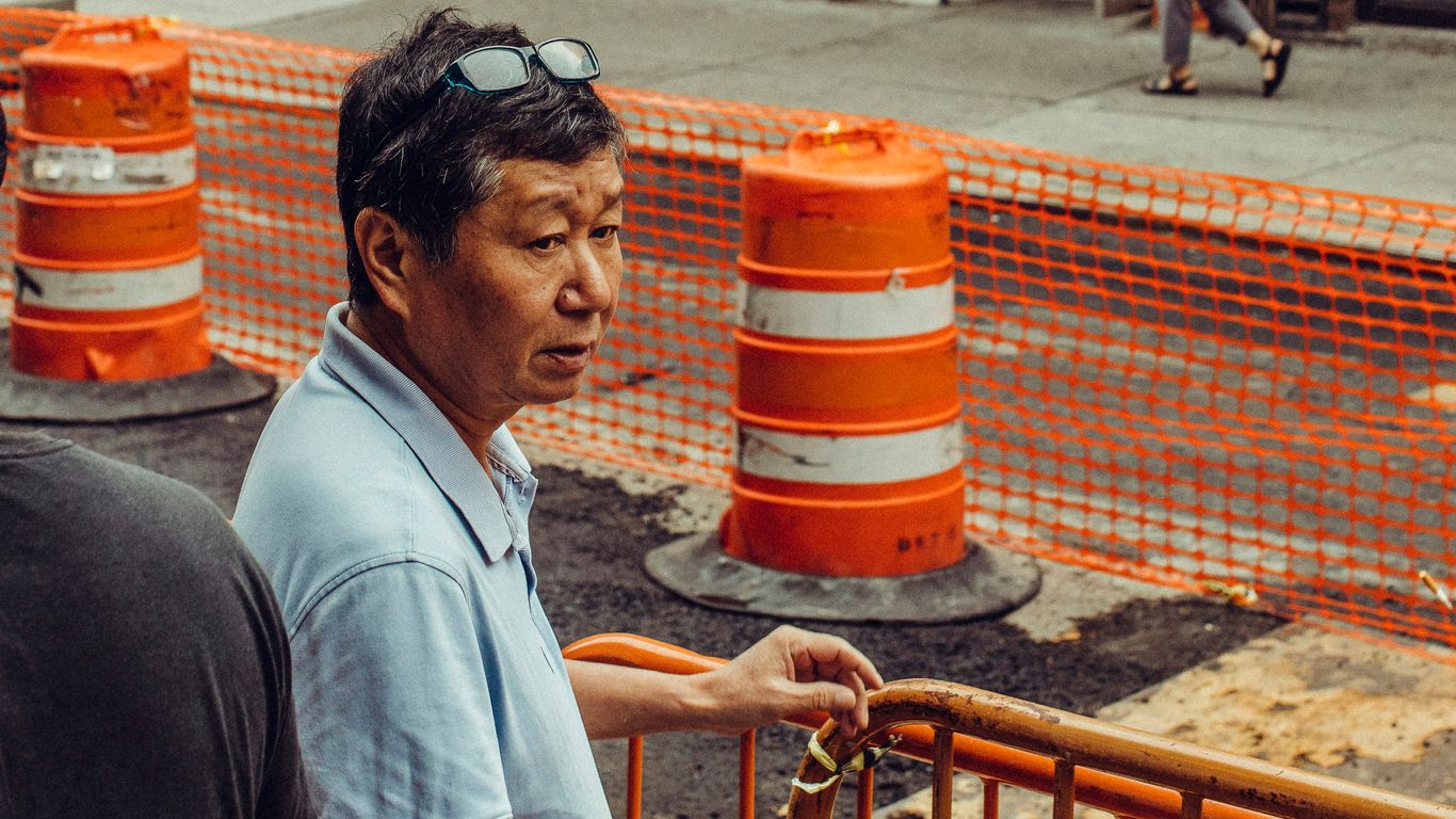 man wearing teal polo shirt