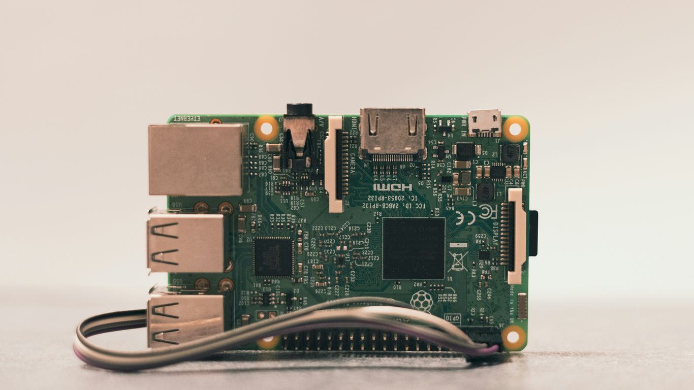 a close up of a motherboard with wires attached