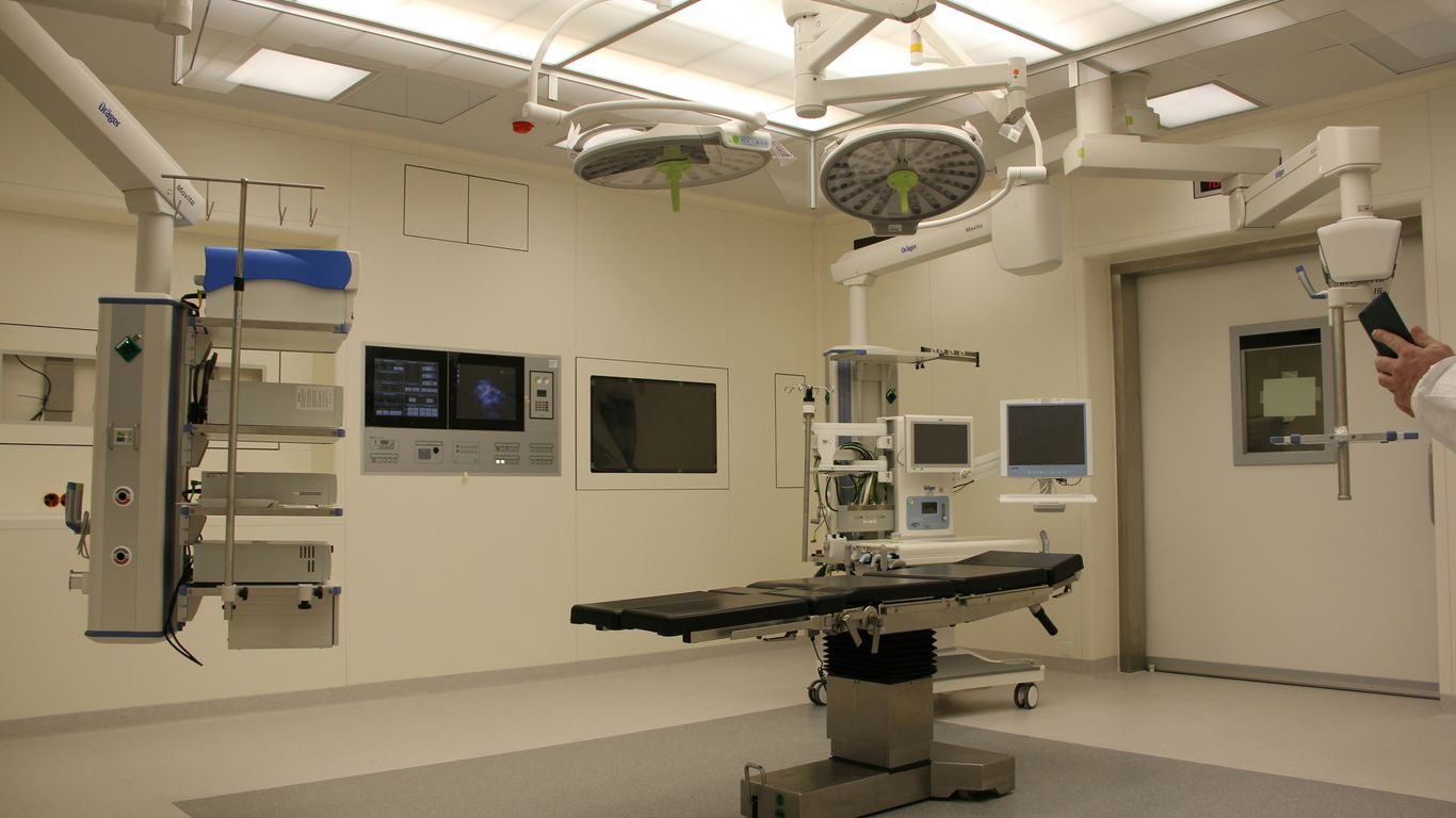 Surgeon reviewing robotic surgery console