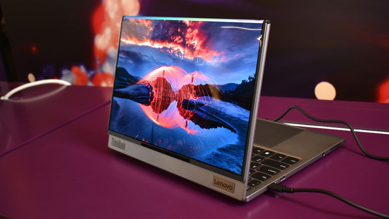 Modern laptop displaying a vibrant landscape on screen.
