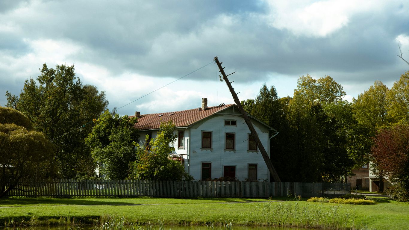 Storm-damaged tree beside a Massachusetts home