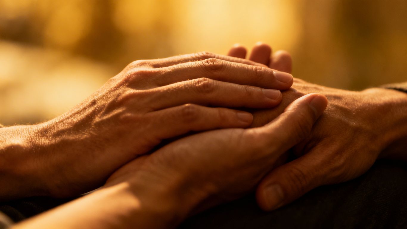 Two hands touching, conveying trust and intimacy.