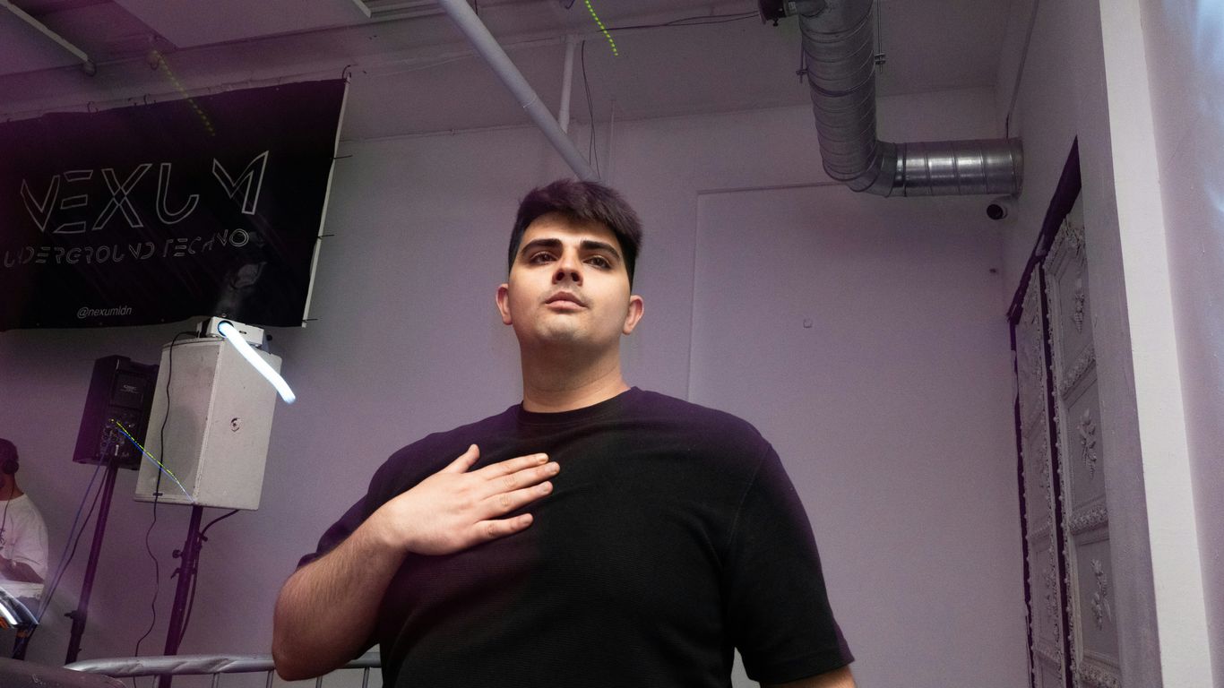 A man standing in a room with a microphone