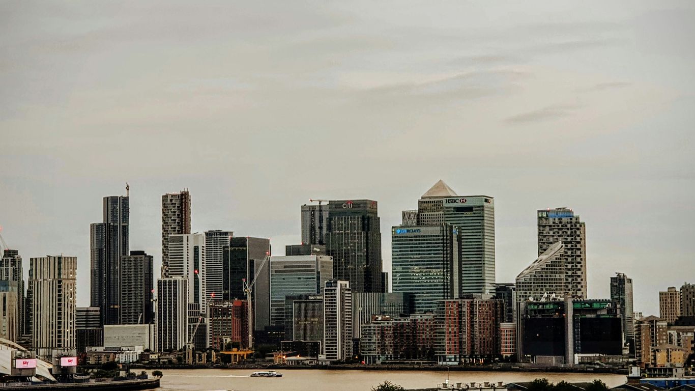 a large body of water with a city in the background