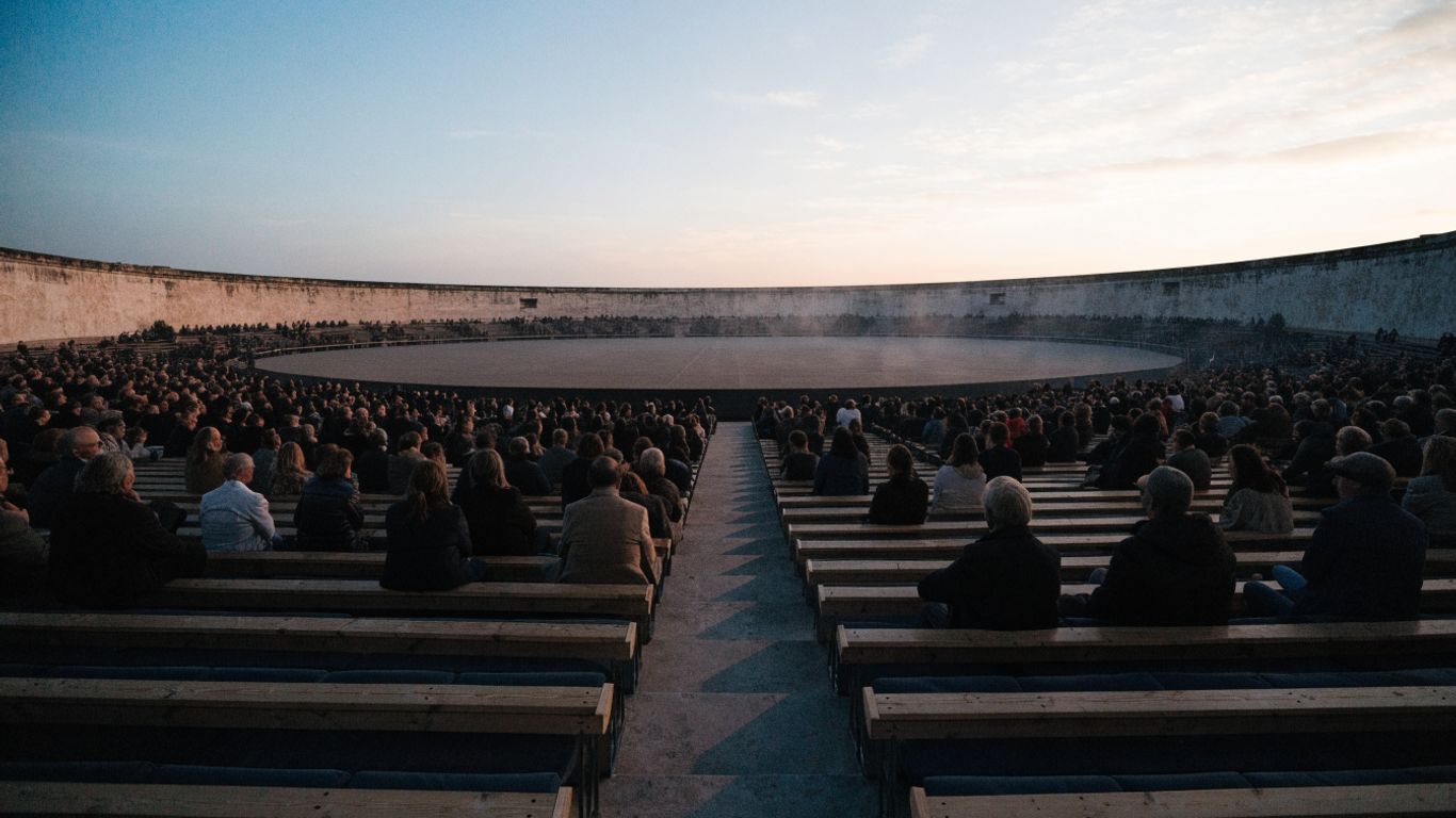 Festival audience seated inside the arena