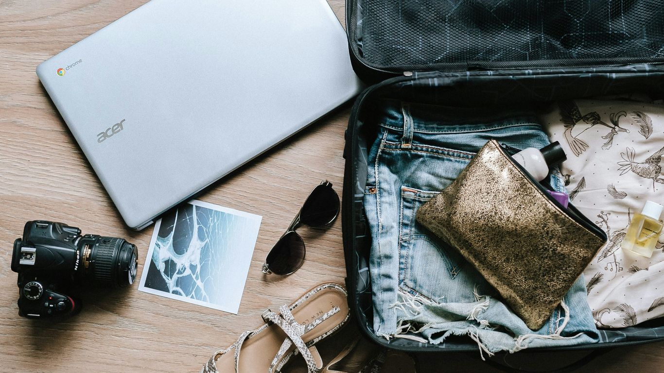 Travel documents beside shipping case