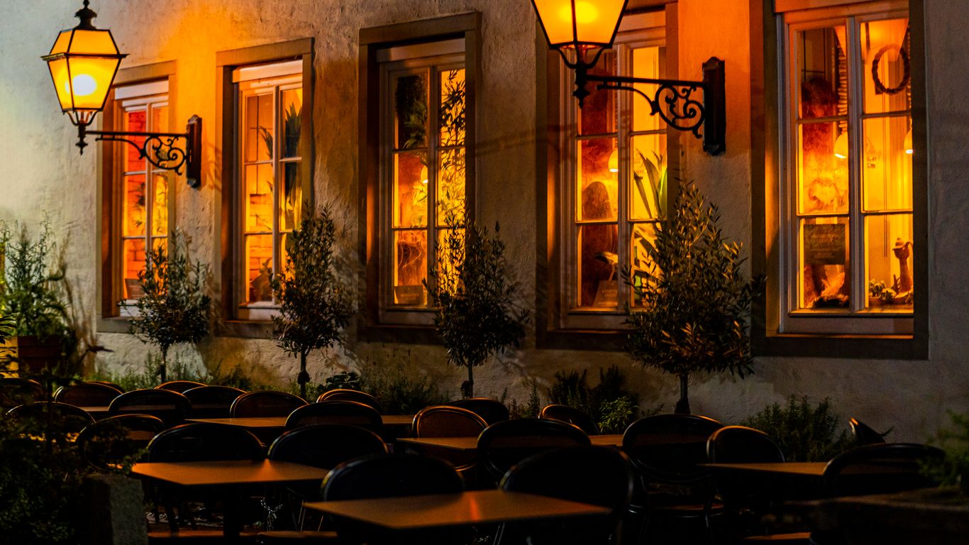 Warm lighting in a cozy, rustic restaurant
