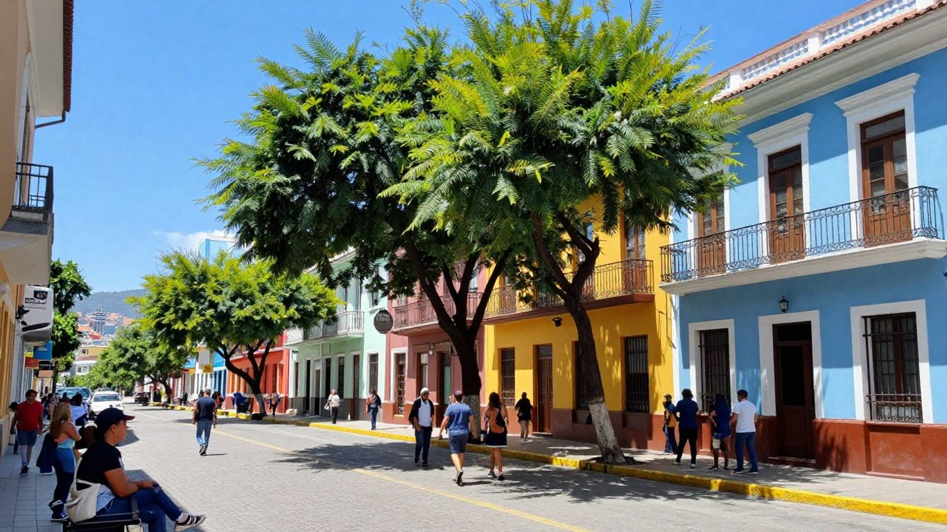 People walking on a colorful street in downtown Medellin.