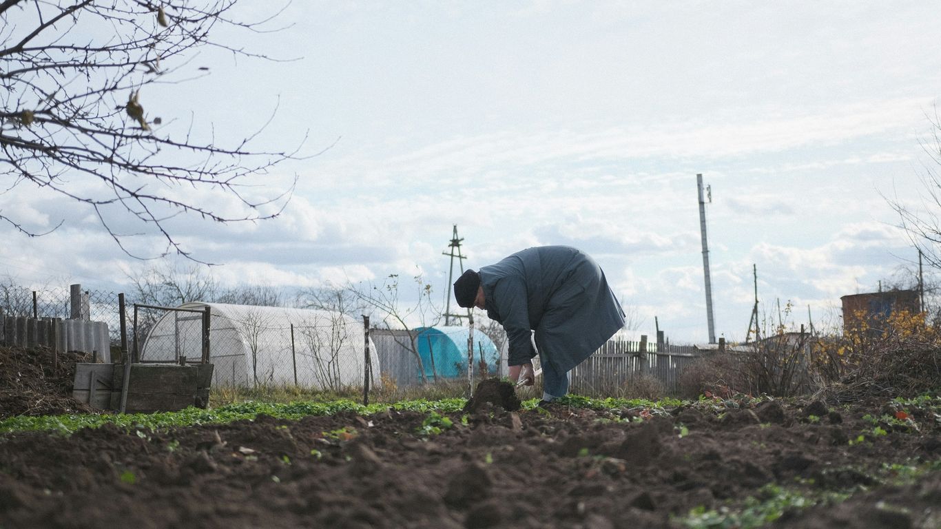 a man digging in the dirt