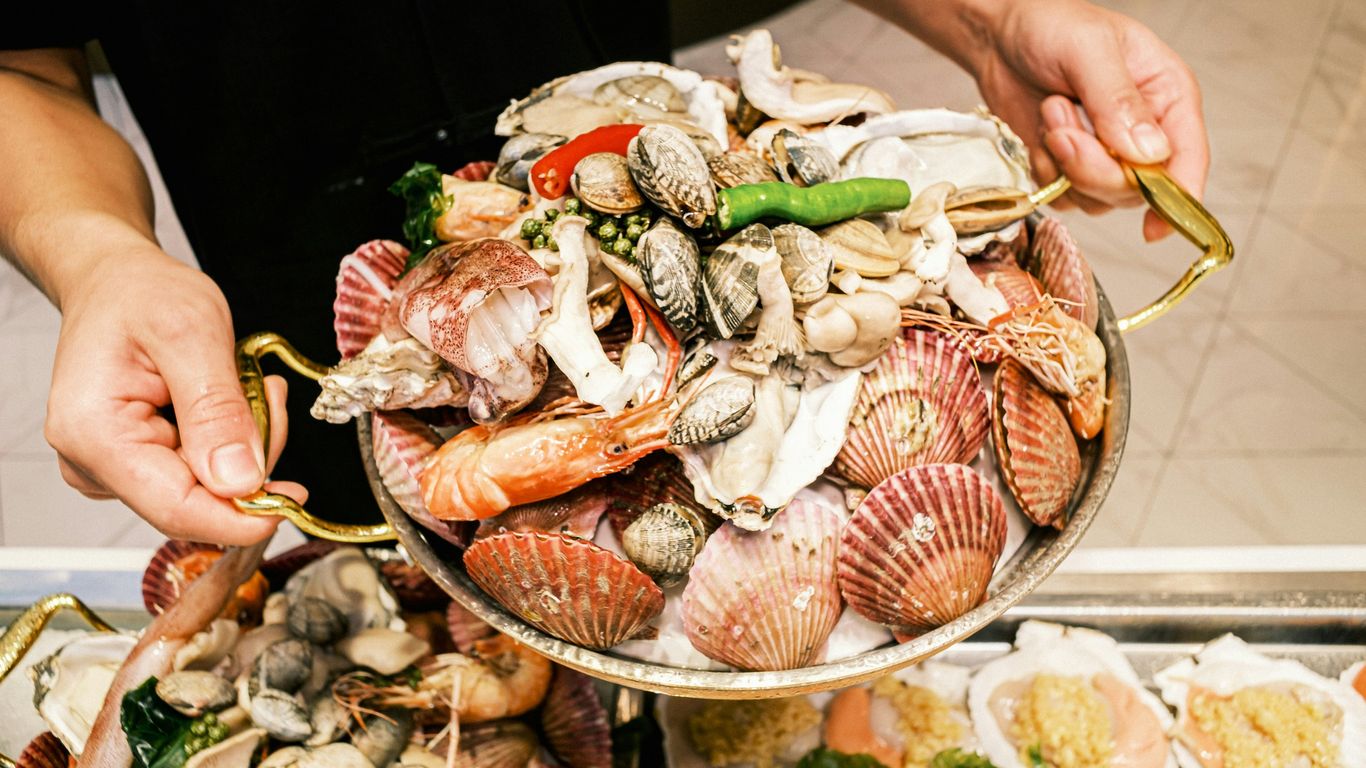 Fresh crabs and side dishes on a restaurant table