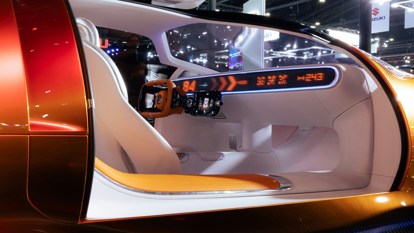 The interior of a futuristic car is shown