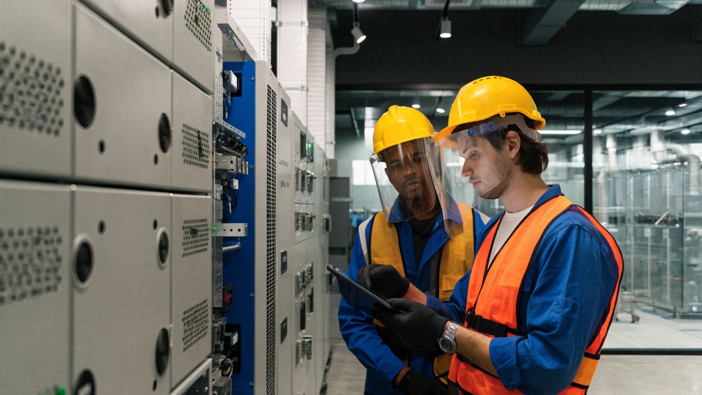 Electrical engineers reviewing a microgrid one-line diagram